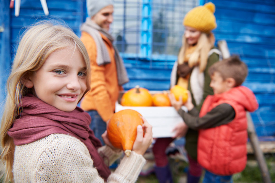 little-girl-with-family-autumn-harvest